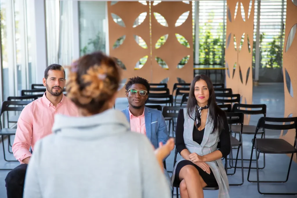 Coworkers sitting and listening speaker about accountability at work